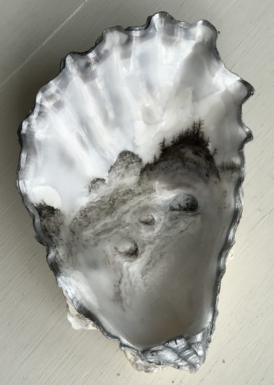 sumi-e style painted oyster shell of "first beach" at "la push" on the Olympic Peninsula in Washington State.