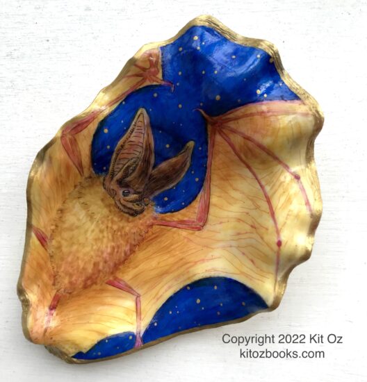 yellow bat on deep blue background, painted inside an oyster shell