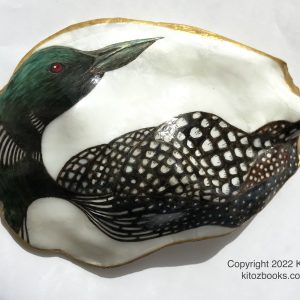 common loon, gavia immer, painted on an oyster shell