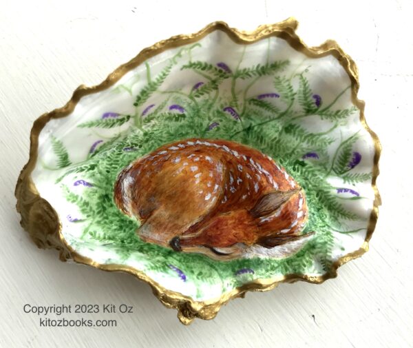 fawn curled asleep in a patch of vetch, painted inside an oyster shell with gold trim