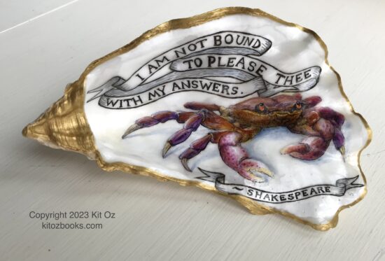 purple crab painted inside an oyster shell, with a banner reading, "I am not bound to please thee with my answers." and "Shakespeare"