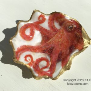 Inside a small oyster shell, a bright red octopus is painted with swirling tentacles.